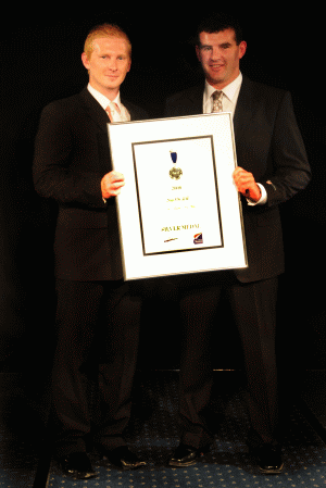 spandexs drew whitten (left) with sign on ltds bevan wealreceiving a silver medal in the concepts or themes category.gif