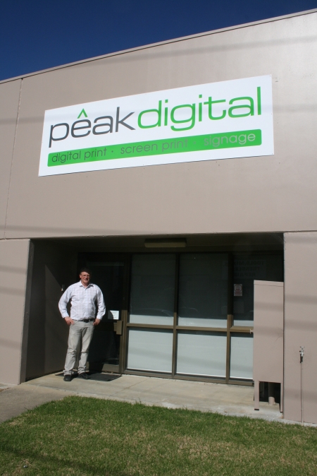 Andrew in front of new building