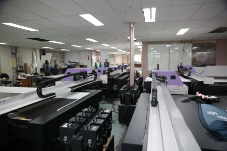 The bank of 13 Mimaki flatbeds that are in continuous use at Avon Graphics