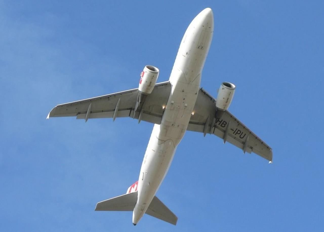Airplane takeoff on blue sky