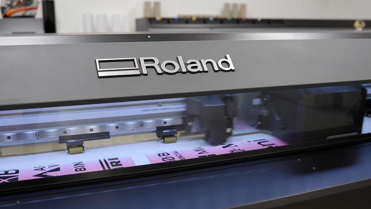 close up of a roland dg printer producing highquality custom prints during a vehicle wrap process